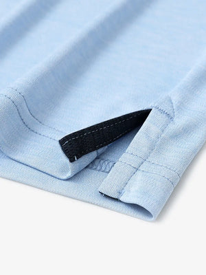 Close-up of hem opening on Modern Fit Melange Polo in LIGHT BLUE HEATHER, highlighting quality stitching.