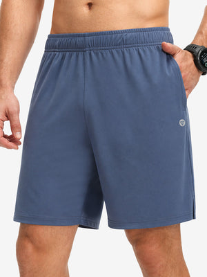 Front lower body shot of model wearing misty blue breathable running shorts with 4 zipper pockets