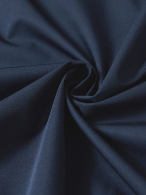 Close-up of navy casual windproof bomber jacket fabric, smooth texture and windproof finish