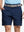 Front waist to knee view of navy water resistant golf 7 inch shorts, clean athletic fit.