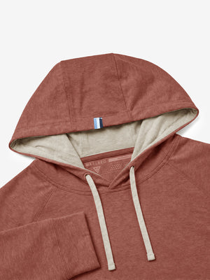 Close-up detail of hood structure, heather midlayer golf hoodies in red ochre heather