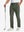Soft lightweight casual golf pants with 5 pockets in olive green, front lower-body view with relaxed fit.