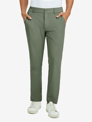 Front lower body view of model with hand in pocket, wearing quick dry casual dress pants in olive green.