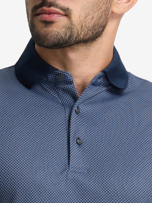 Front view from nose to chest of model wearing the blue quick dry jacquard ribbed collar golf shirts