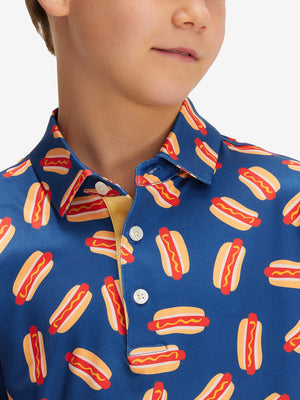 Close-up: nose to chest in hot dog performance print boys golf polo
