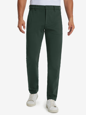 Model wearing Golf Lightweight Fleece Lined Dress Pants in forest green, lower body front view