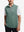 Upper body front view of model wearing dark green melange lightweight sleeveless quarter zip golf vest