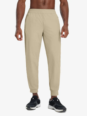 Front lower body view of model wearing KHAKI Performance Tapered Sports Joggers