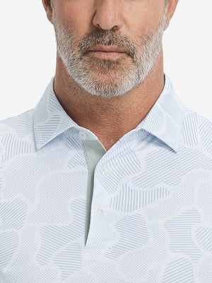 Close-up from nose to chest, showing collar and fabric pattern detail of the light gray irregular pattern polo shirt.
