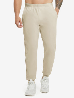 Model wearing Water Resistant Comfy Fleece Golf Joggers in light khaki, lower body front view