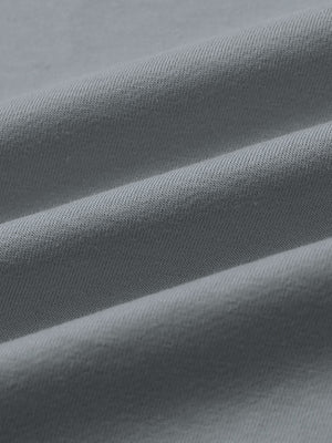 Close-up of fabric on 2 in 1 running sports shorts with liner, showing texture and finish in light grey