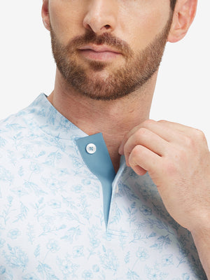 Close-up: nose to chest in white blue florals stretch printed collarless henley golf shirts