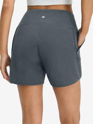 Pantalones cortos de secado rápido 2 en 1 de talle alto para mujer con 7 bolsillos