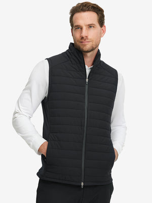 Model wearing Lightweight Water Resistant Puffer Vest in black, upper body front view