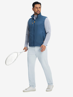 Model holding a tennis racket, wearing misty grey soft lightweight casual golf pants with 5 pockets.