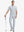 Full-body front shot with golf club, styled in Stretch Plain Everyday Pants – GLACIER GREY