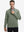 Model grabbing half-zip collar, wearing casual fleece lined quarter zip pullover in green.