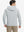 Back view of model wearing texture solid hoodies pullover showing fit and hood detail, light grey heather.