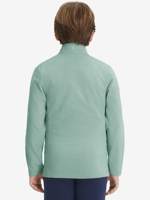 Model in kids soft lightweight fleece lined jacket in dusty green, showing back half-body view.
