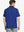 Back half-body view of male model wearing the Klein Blue Everyday Classic Solid Polo