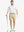 Full body front view of model wearing KHAKI 7 Inch Heather Performance Golf Shorts, holding a golf club