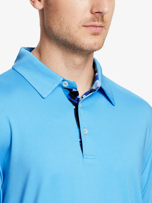 Male model wearing the Sky Blue Everyday Classic Solid Polo, front view from nose to chest