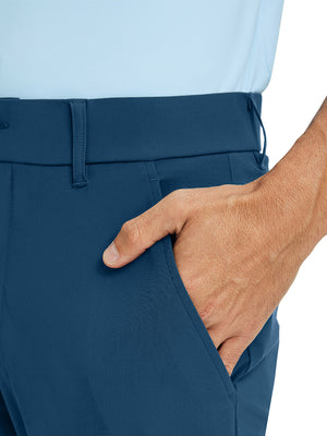 Close-up detail of one hand resting in pocket, showing relaxed fit of the blue indigo quick dry pants.