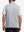 Back upper body shot of model wearing lunar rock melange lightweight sleeveless quarter zip golf vest