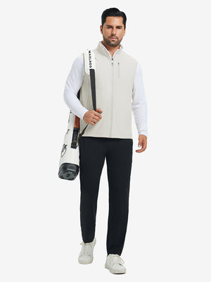 Lifestyle shots of water-resistant fleece golf vests in oyster grey, worn while holding golf bag