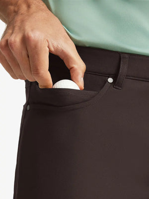 GLACIER GREY 4-way Stretch Performance Solid Shorts, front pocket holding golf ball detail, 7 Inch