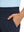 Close-up detail of one hand resting in pocket, showing relaxed fit of the navy quick dry pants.