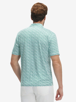 Back half-body view of model wearing the green lucky clover 4 way stretch print collared polo shirt, highlighting the rear silhouette