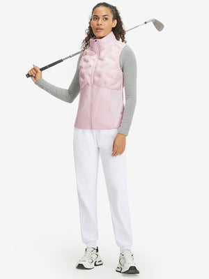 Model holding golf club full body, women's lightweight slim-fit puffer vest styled in sporty light pink