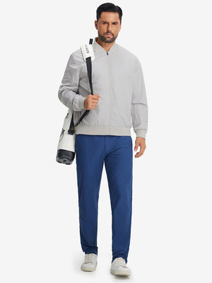Model carrying golf bag in casual windproof bomber jacket, sporty look in glacier grey