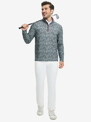 Full-body shot of model holding golf club, dressed in full print quarter zip pullover in grey/wine camo.