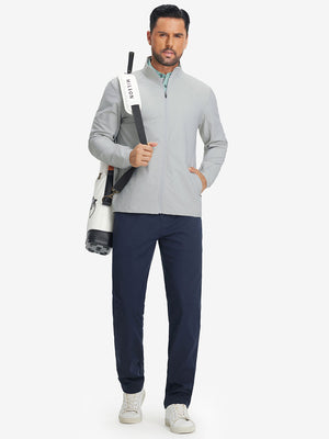 Model carrying tennis bag in lightweight water-resistant outerwear jacket, sporty silver grey look