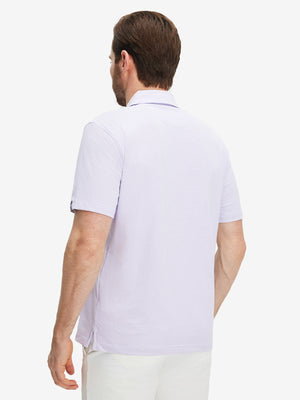 Front half-body view of a model wearing the lavender feather weight jacquard polo shirts, showing the chest pocket