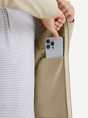 Close-up of the front side pocket detail on kids soft lightweight fleece lined jacket in light khaki, showing quality stitching.