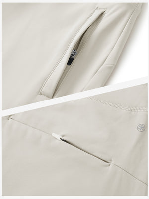Detailed view of the front side pocket on women's stretch fleece lined water resistant joggers in oyster gray, showing stitching and design.