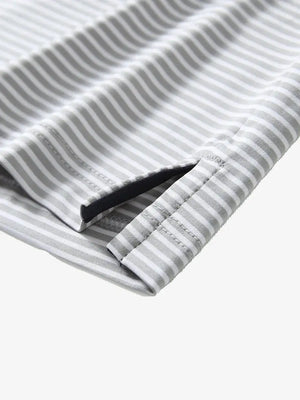 GREY WHITE STRIPEClose-up detail of side hem slit on Cooling Stripe Golf Shirt in GREY WHITE STRIPE, emphasizing comfort and finish