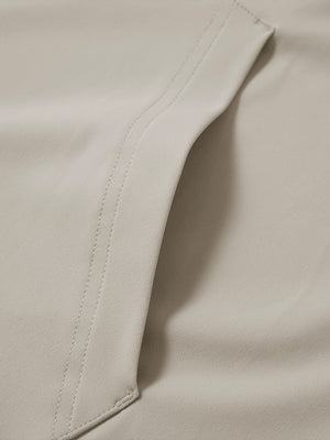 Close-up of single pocket detail on youth long sleeve hoodied with kangaroo pocket in khaki light, showing stitching.