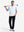 Front full body shot of model wearing white lightweight sleeveless quarter zip golf vest with golf club resting on shoulder
