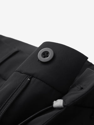 Waist detail of quick dry casual dress pants in black, featuring button and zipper design.