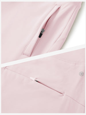 Detailed view of the front side pocket on women's stretch fleece lined water resistant joggers in light purple, showing stitching and design.