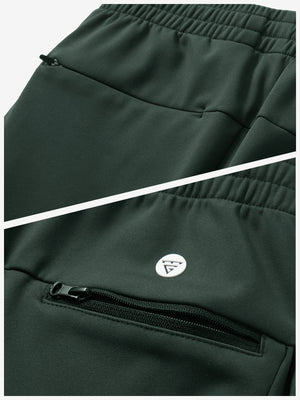 Close-up of the zipper detail of forest green fleece stretch water resistant boys joggers.