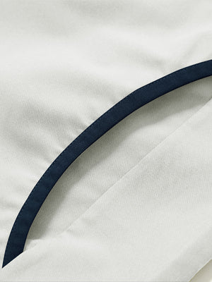 Side pocket detail of the mock neck quarter button golf pullover in silver gray, practical design feature.