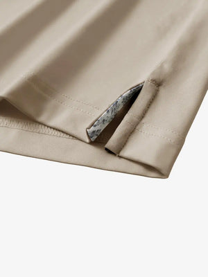 Close-up of side slit detail on the Dark Khaki Everyday Classic Solid Polo hem