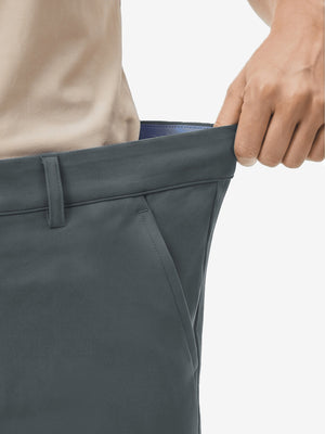 Detail view of elastic waistband on dark gray women's regular fit stretchy golf pants
