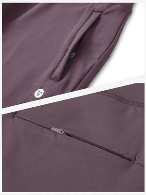 Detailed view of the front side pocket on women's stretch fleece lined water resistant joggers in light pinkish purple, showing stitching and design.