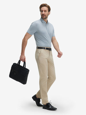 Full-body shot of model holding a briefcase in white light blue grid ultra-light quick dry moisture wicking collared polo shirt